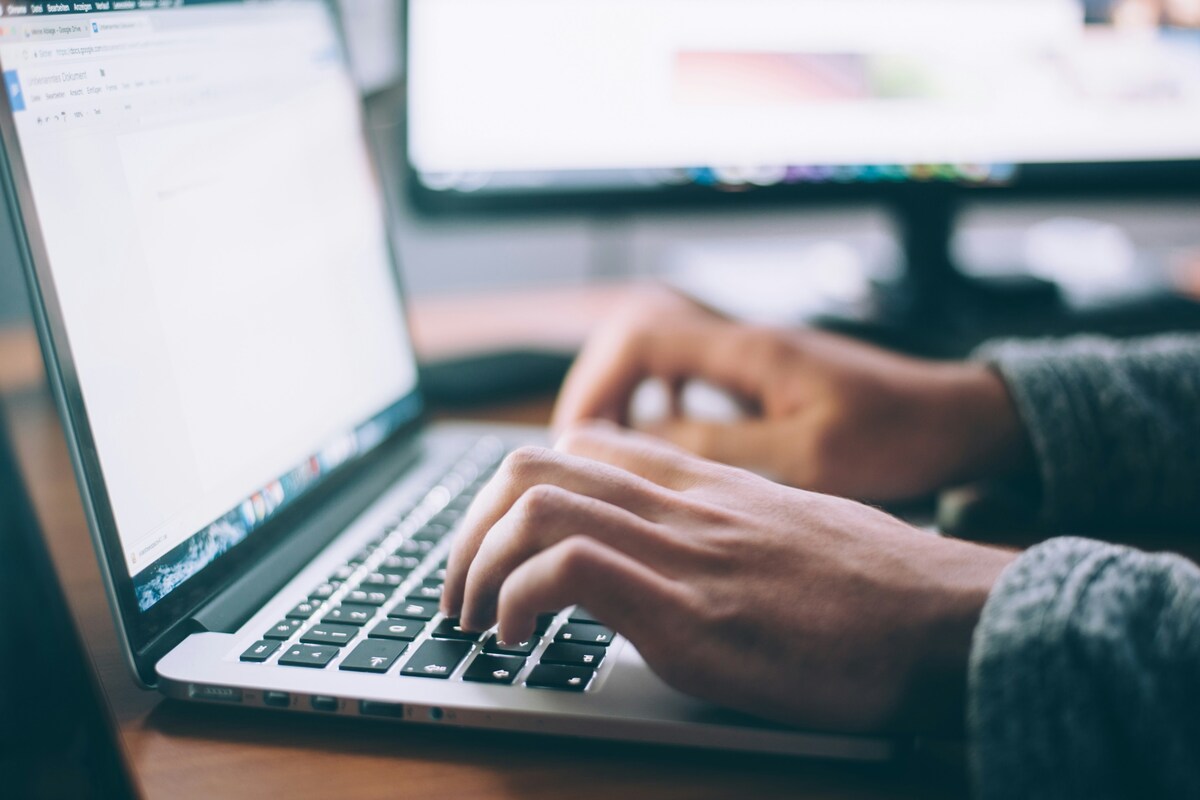 Typing at a laptop